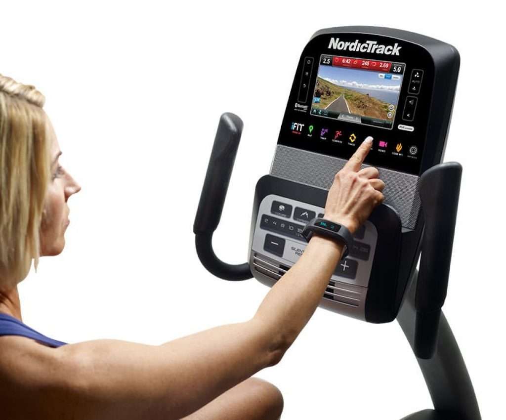 woman adjusting console on NordicTrack Commercial VR25