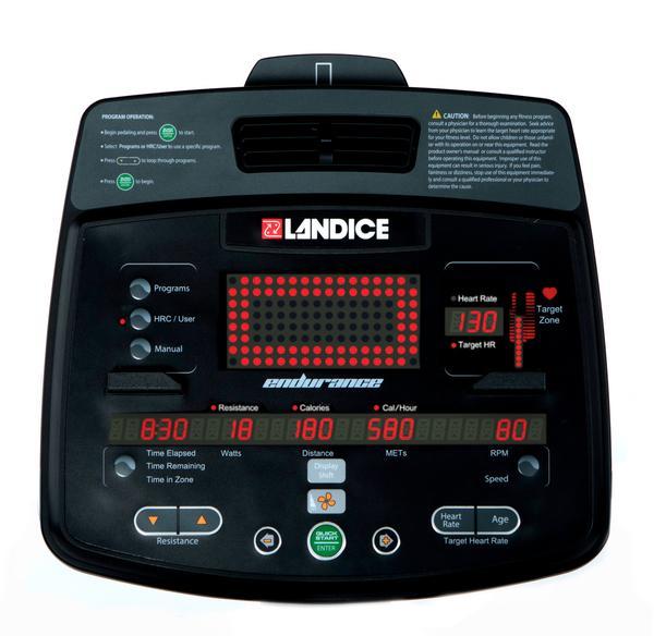 A black exercise bike console with red LED's.