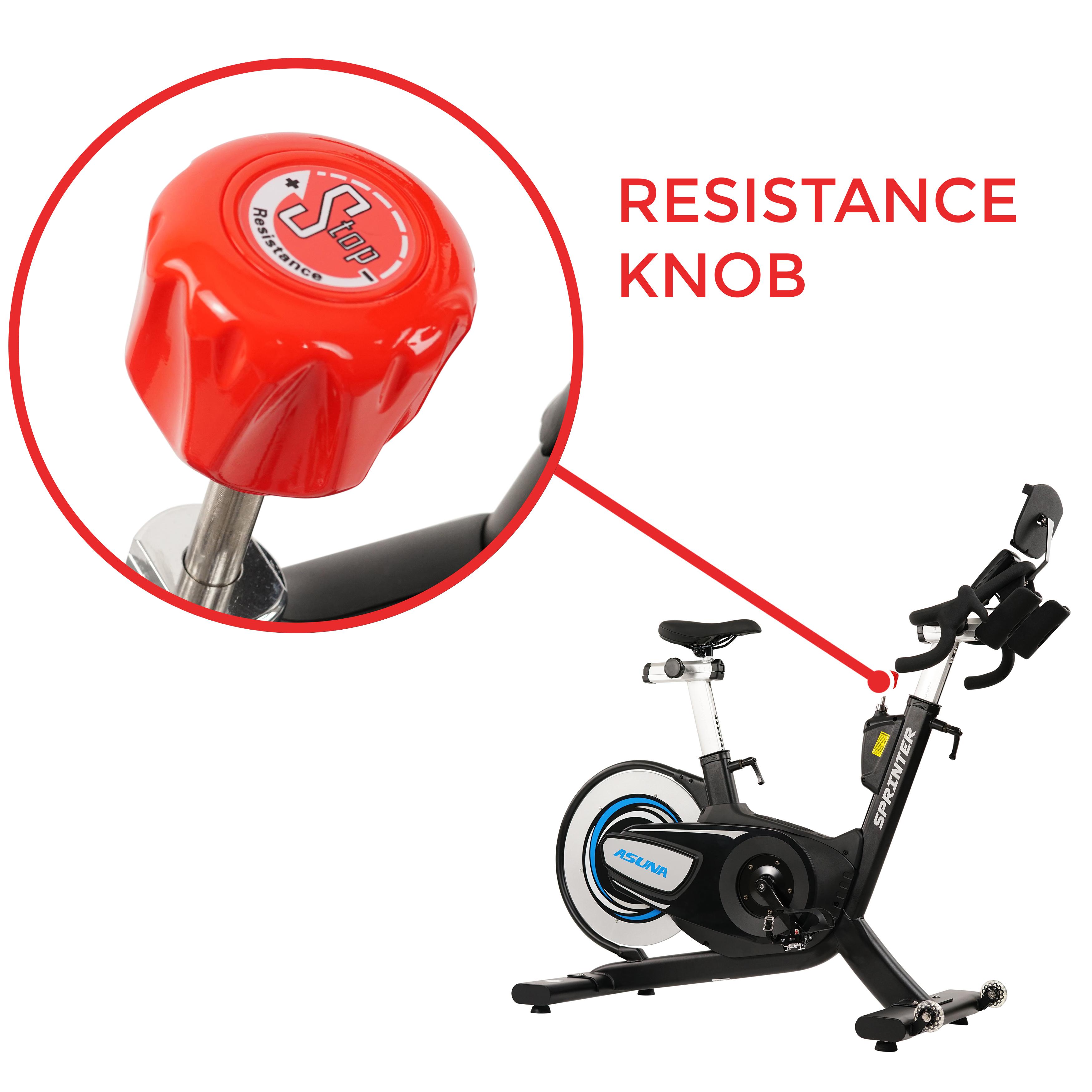 Detail view of a red resistance knob on a black exercise bike.